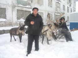 Reindeer and two men